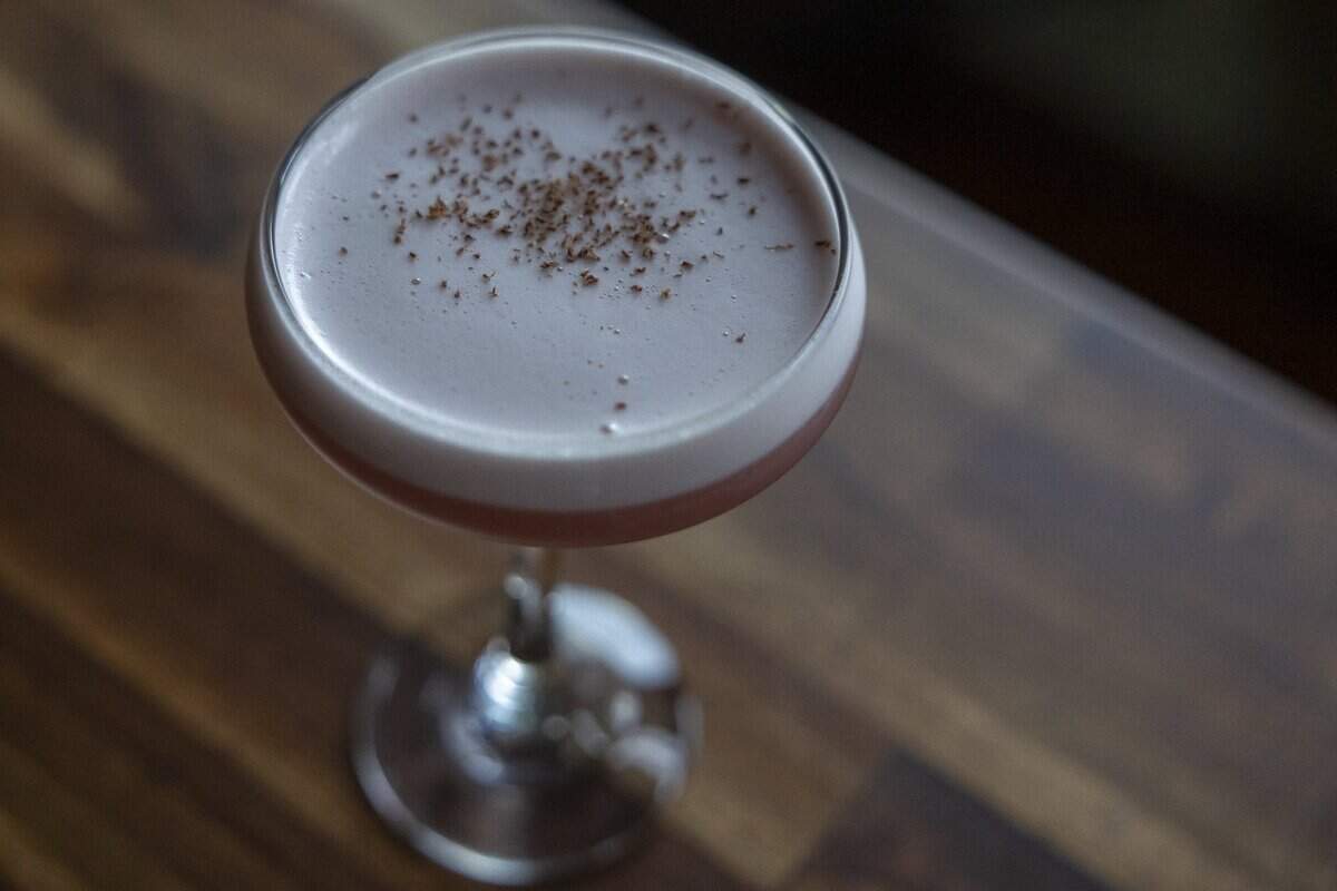 Quiet Quitting, a drink that includes mezcal, pomegranate, lime and chocolate bitters, is photographed at Mulberry Street Bar & Kitchen in Lexington, Ky., on Wednesday, July 8, 2026.
