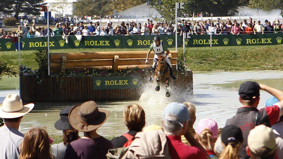 Christopher Burton of Australia took Holstein Park Leilani through the Land Between the Lakes jumps of the cross country eventing course on Saturday at the Horse Park, where attendance reached 50,818. See eventing coverage on Page B1.