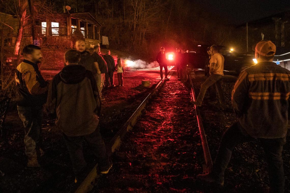 Miners, who say they haven’t been paid in three weeks, block a coal train in Pike County, Ky., Monday, Jan. 13, 2020.