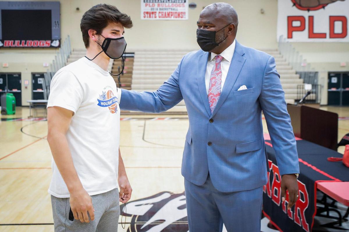 Paul Laurence Dunbar basketball player Max Van Dyke greeted newly announced head coach Murray Garvin at Friday’s announcement. “We have a lot of seniors and we want to go out with a bang, so hopefully, we can do that,” Van Dyke said.