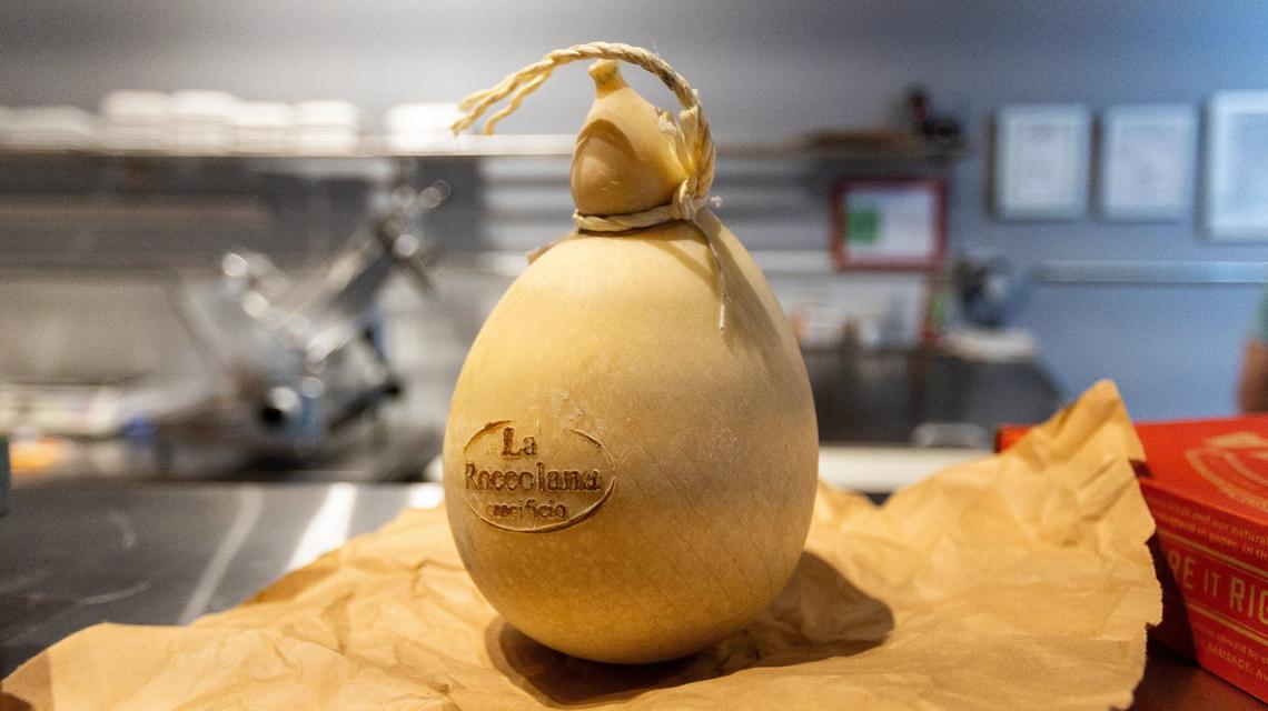 Caciocavallo cheese offered among several other cheeses within Cibon grocery, wine and bar on Rosemont Garden. May 28, 2024.