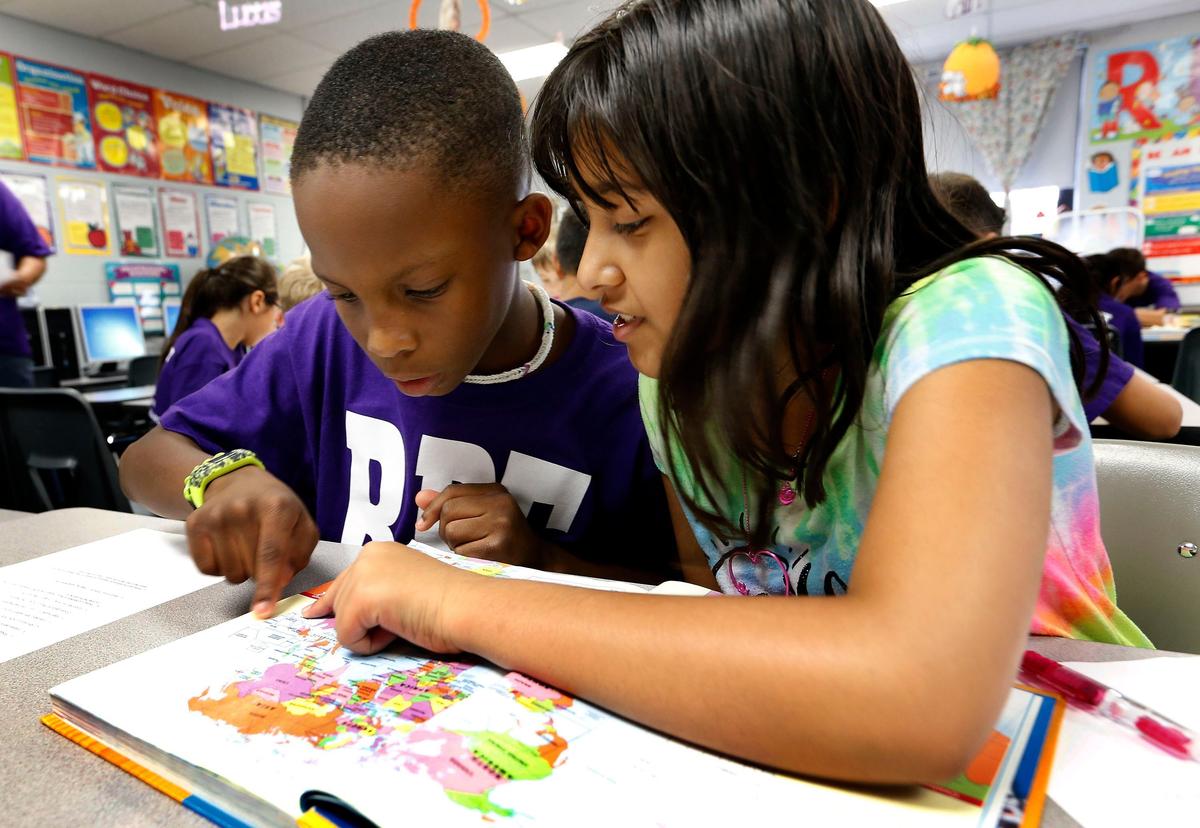 Students Dillon Jenkins, left, and Eshaal Tatla, right, worked together in teacher Missy Wright’s fourth grade social studies class Tuesday afternoon at Rosa Parks Elementary School, 1251 Beaumont Centre Lane. The school is one of the top 10 elementary schools in the state in student performance in reading and math.