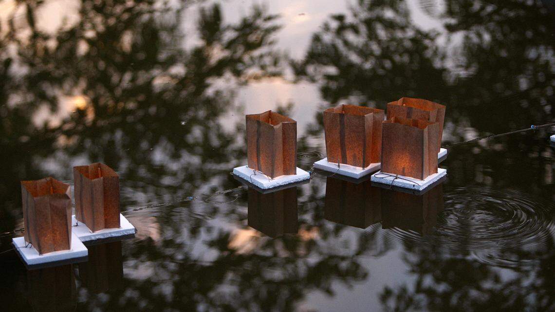 Floating lanterns were released Sunday at Jacobson Park as the Central Kentucky Council for Peace and Justice commemorated the 70th anniversary of the bombing of Hiroshima and Nagasaki, Japan.