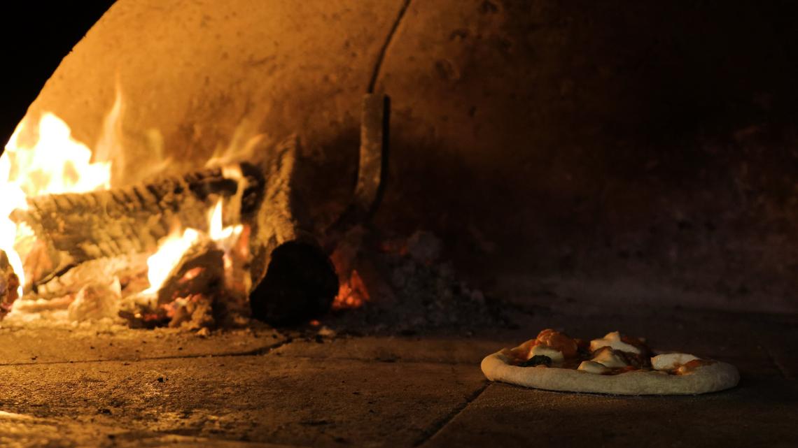 To bake their pizza’s, Tomatoes and Flames has a Mugnaini Oven, an Italian company specializing in wood-fire ovens. The temperature reaches 800 degrees.