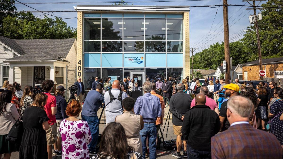 Lexington Mayor Linda Gorton, at podium, speaks during a ribbon cutting ceremony at the new Marksbury Family WayPoint Center in Lexington. The center is owned and operated by United Way of the Bluegrass and was funded by the Marksbury Family Foundation.