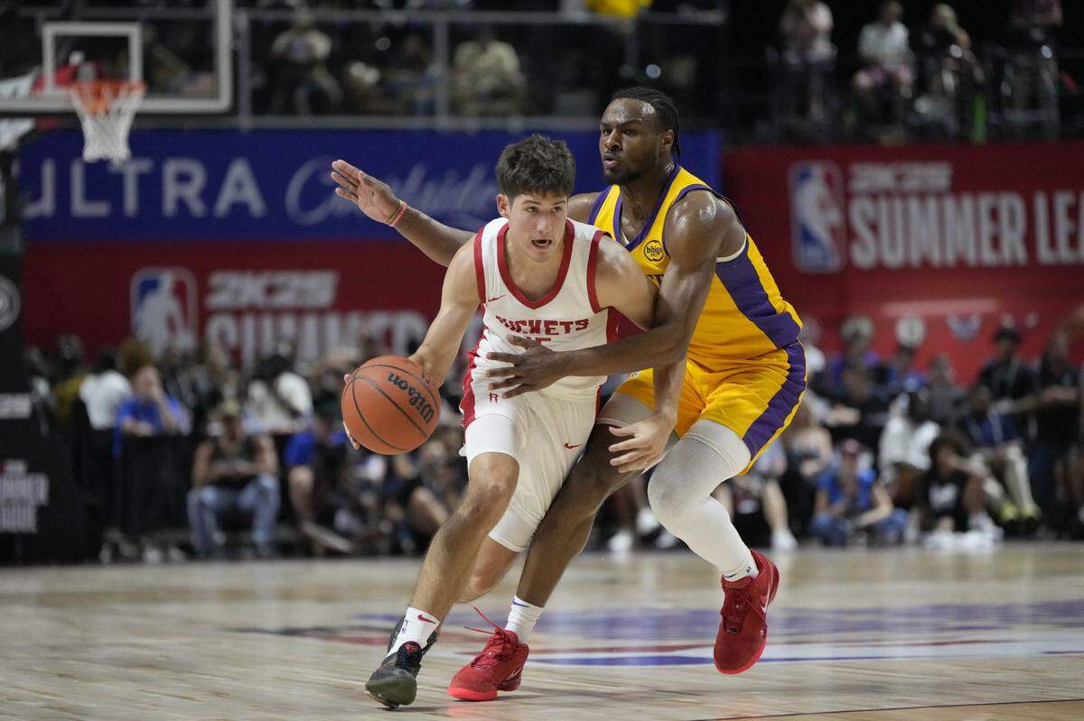 Reed Sheppard looks for room to operate against Lakers guard Bronny James on Friday night. Sheppard led Houston with 23 points. James scored eight for Los Angeles.