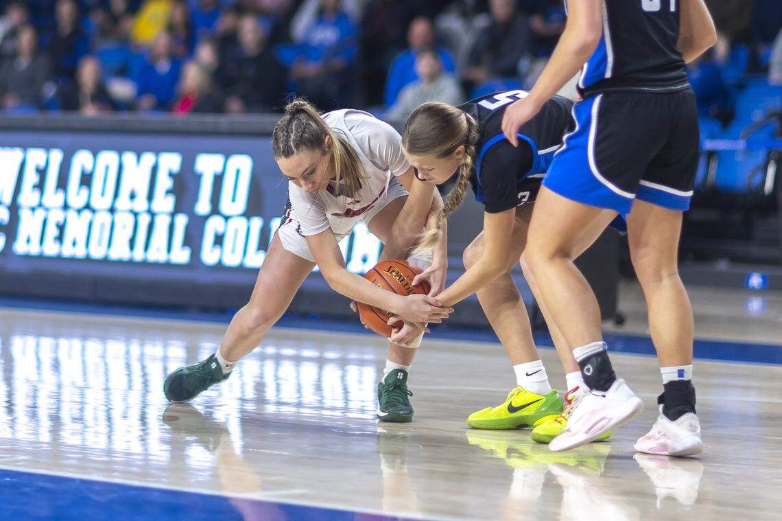 Dunbar's Kaleigh Potts and Lexington Christian's Somer Du Toit battle for the ball during a game at Historic Memorial Coliseum on Friday, Feb. 6, 2026.