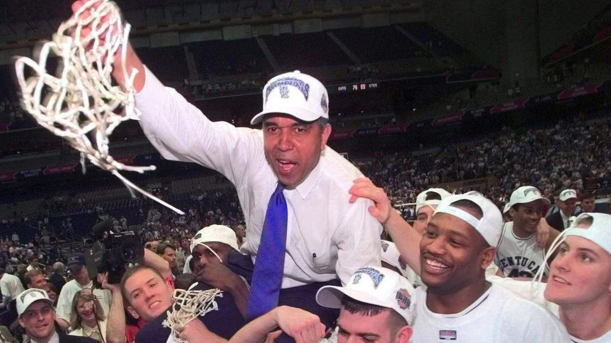Tubby Smith is carried off the court by Jeff Sheppard, left, Steve Masiello, center right, and Jamaal Magloire second from right, at the Alamodome in San Antonio after the Wildcats won the 1998 NCAA basketball championship. Sheppard is among Smith’s former players expected to be on hand in Rupp Arena when UK retires a jersey in its former head coach’s honor on Friday.