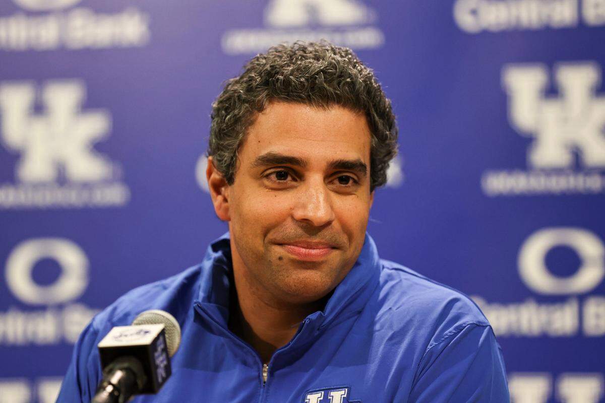 New UK football offensive coordinator Bush Hamdan has promised to find the balance between running a pro-style offense and simplifying things for college players.