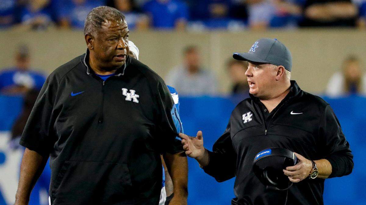 Vince Marrow, left, is the only assistant coach who had been with Mark Stoops, right, at Kentucky since the latter became UK head man before the 2013 season. However, ESPN’s Pete Thamel reported Monday that Marrow is expected to leave UK to become general manager of Louisville’s football program.
