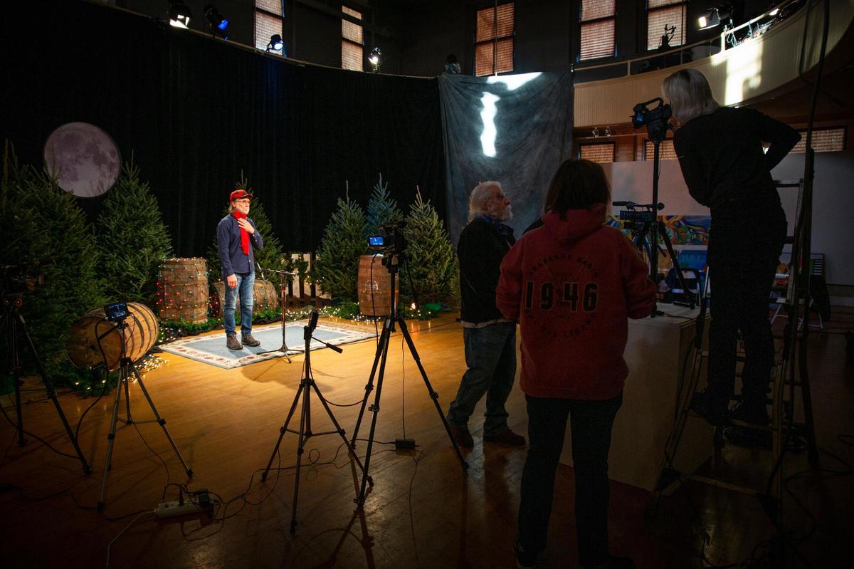 Brad Becker, Red Barn Radio’s associate producer and host, records an introduction during the taping their Christmas special, An Appalachian Christmas, in Lexington, Ky., on Wednesday, Dec. 2, 2020.
