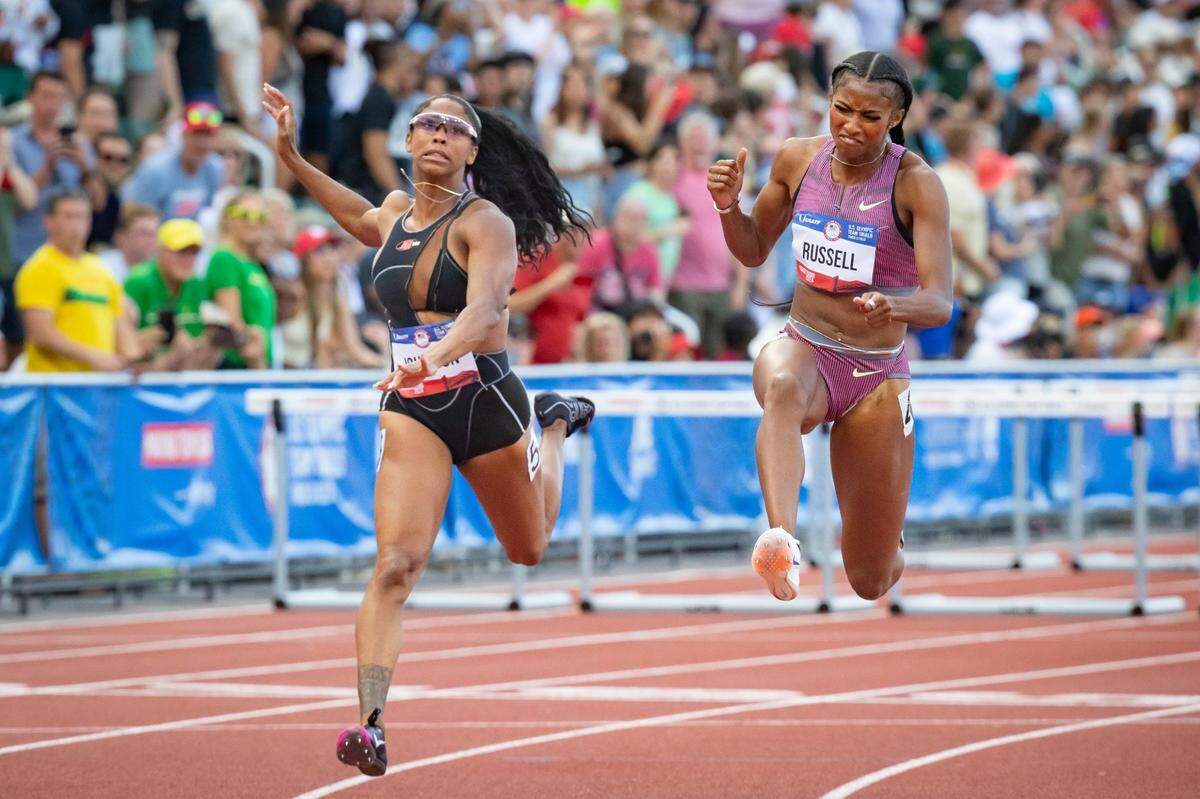 Masai Russell, right, edges out Alaysha Johnson to win the women's 100 meter hurdles during the final day of the U.S. Olympic Track & Field Trials Sunday, June 30, 2024, at Hayward Field in Eugene, Ore.