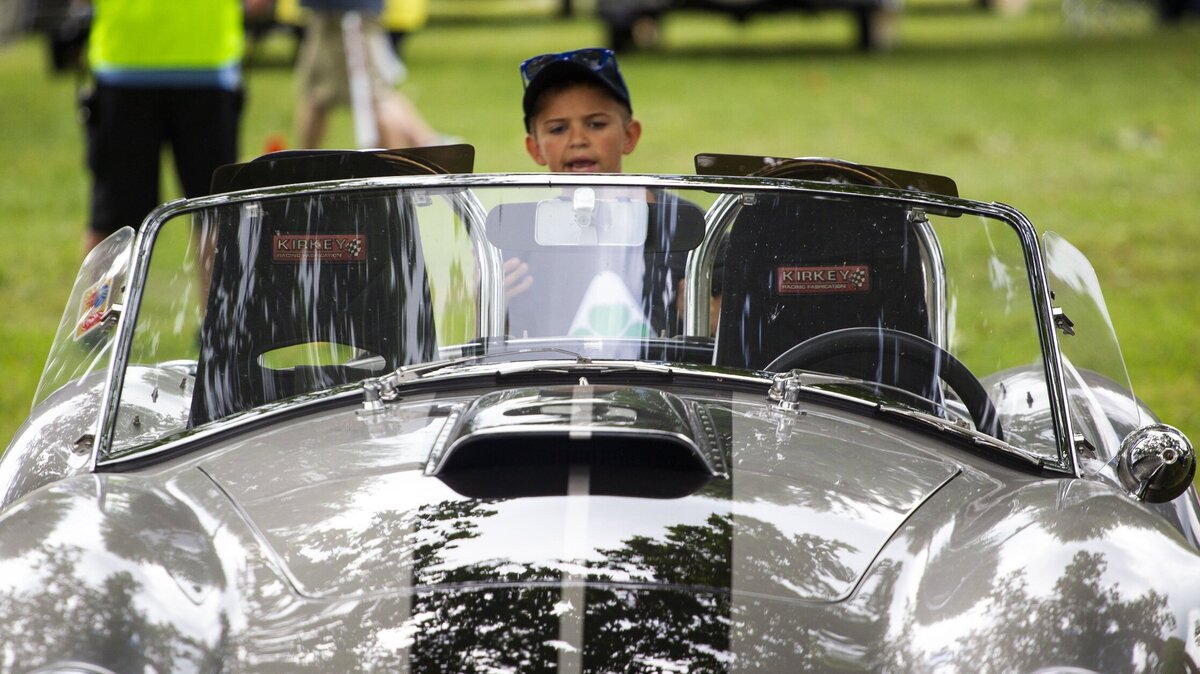 Andrew Monroe, 9, looked at a car during the annual Keeneland Concours d’Elegance at Keeneland Race Course in Lexington on Saturday.