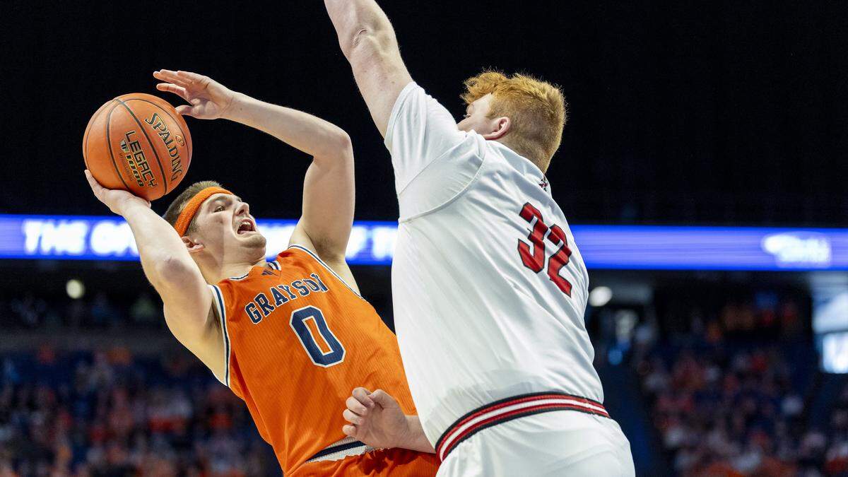 Grason County's Brody Armstrong (0) tries to put up a shot over Taylor County's Bryten Close (32) during a first-round game in the 2026 UK Healthcare Boys' Basketball Sweet 16 state tournament, Wednesday, March 18, 2026 at Rupp Arena in Lexington, Ky.