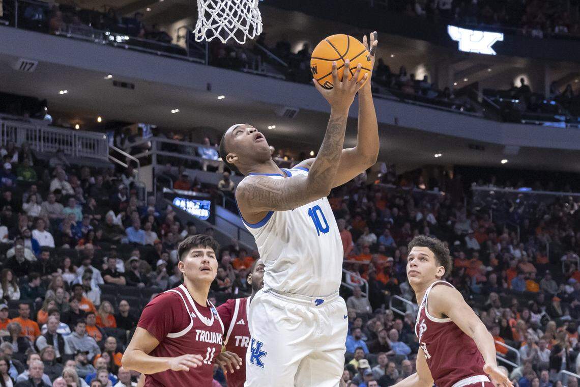 Kentucky forward Brandon Garrison (10) shoots the ball around Troy forward Jerrell Bellamy (10) during a first-round NCAA Tournament game at Fiserv Forum in Milwaukee on Friday.