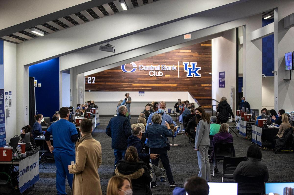 People receive the COVID-19 vaccine at the University of Kentucky HealthCare Vaccination Program at Kroger Field in Lexington, Ky., Tuesday, Jan. 19, 2021.