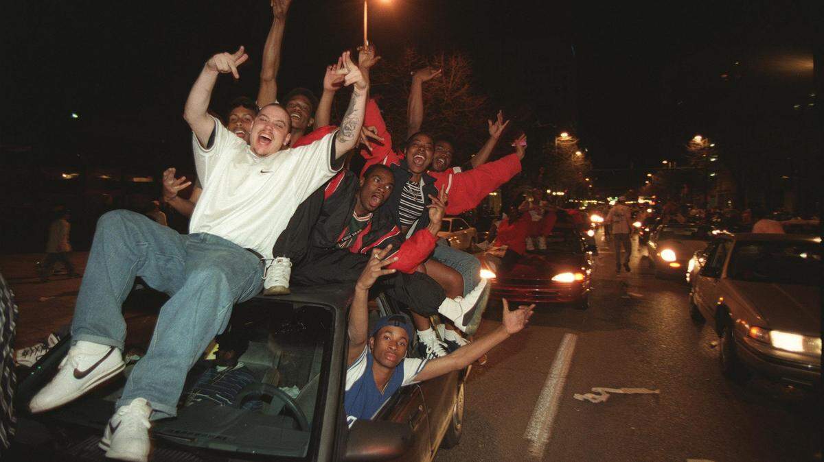 Fans celebrated downtown after UK won the NCAA championship on March 30, 1998. 