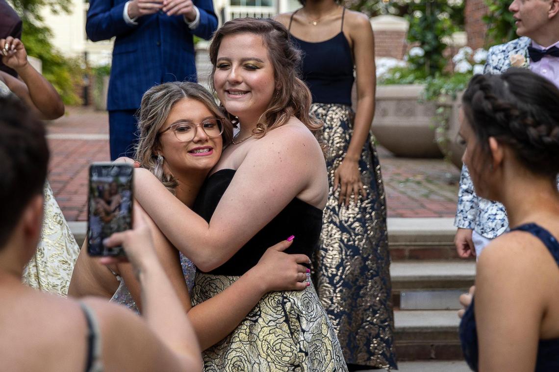 Macy Dungan and her friend Tatum Williams take photos outside the Lieutenant Governor’s Mansion in Frankfort before heading to prom on Saturday, May 15, 2021.