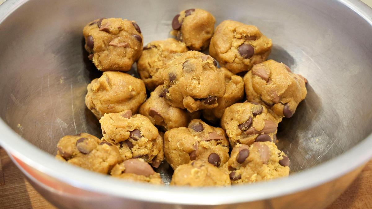 Balled-up dough for chocolate chip + sea salt cookies sit in a bowl before being baked at Wild Lab Bakery. Co-owner Chapi Johnson says several factors contribute to the cookie being so popular particularity the ingredients. “We use high quality flour, einkorn flour, which really elevates the cookie and gives them a depth of flavor and it also makes them healthier,” Johnson said.