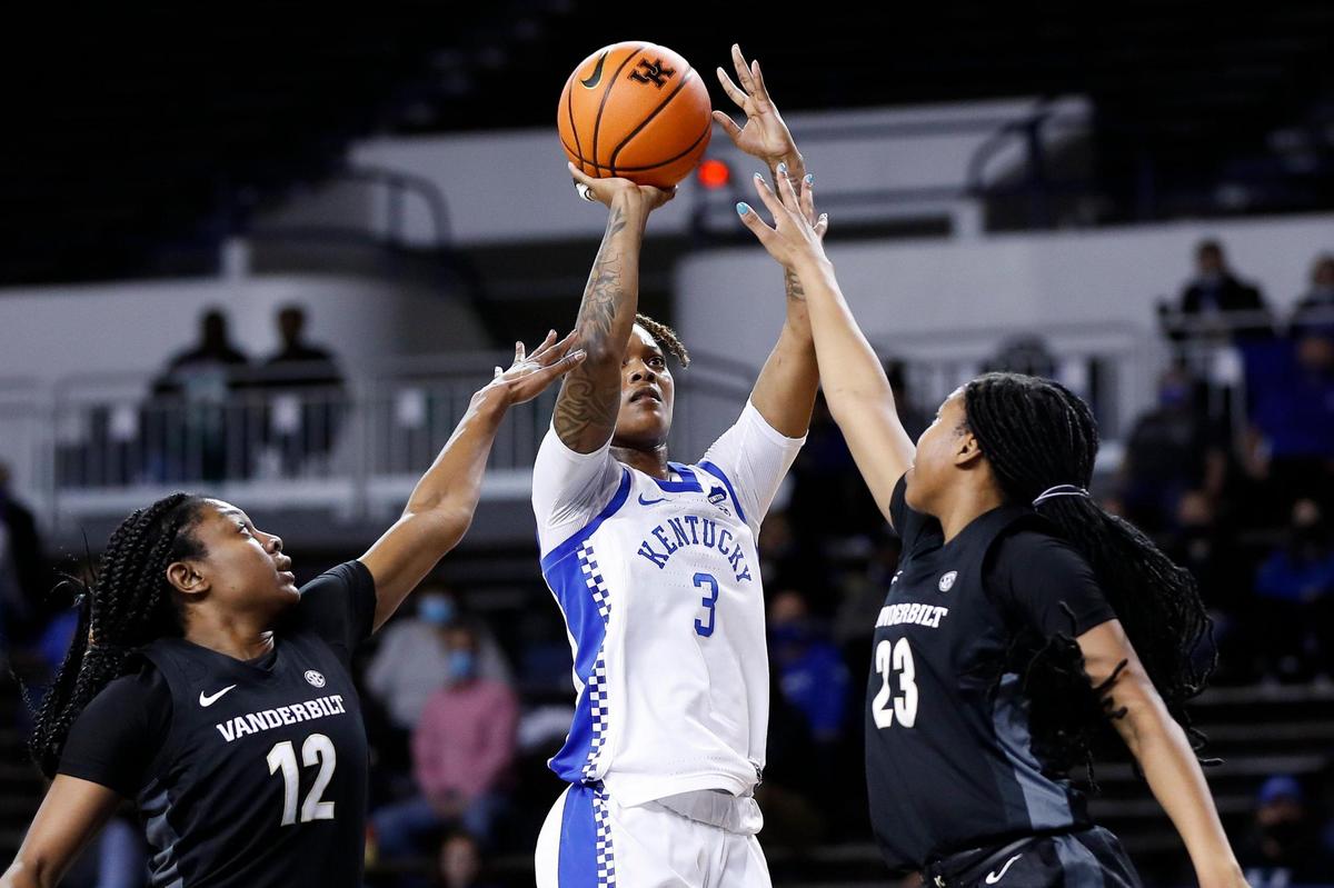 Kentucky Wildcats guard Jazmine Massengill (3) shoots the ball through Vanderbilt Commodores guard Demi Washington (12) and Vanderbilt Commodores guard Iyana Moore (23) during the game at Memorial Coliseum in Lexington, Ky., Thursday, February 17, 2022.
