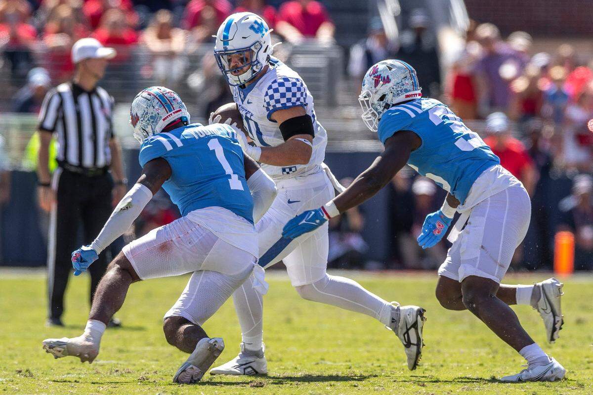 Mississippi Rebels safety Isheem Young (1) and Mississippi Rebels linebacker Ashanti Cistrunk (36) chase down Kentucky Wildcats tight end Brenden Bates (80) during a game at Vaught-Hemingway Stadium in Oxford, Miss., on Saturday, Oct. 1, 2022.