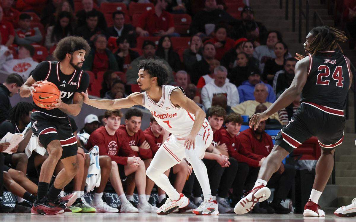 Troy guard Tayton Conerway (12) is the 2024-25 Sun Belt Conference Player of the Year. Conerway will lead the No. 14 seed Trojans against No. 3 seed Kentucky Friday in the men’s NCAA Tournament round of 64.