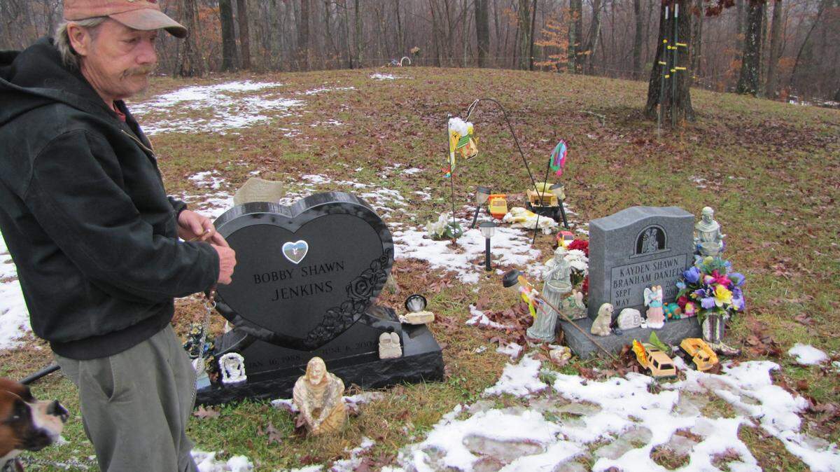 Clarence Jones, stood beside the graves of his grandson, Bobby Shawn Jenkins, killed in an ATV wreck in 2004, and his great-grandson, Kayden Branham Daniels, who died in May 2009 after drinking drain cleaner left out in a home where methamphetamine allegedly had been made.﻿
