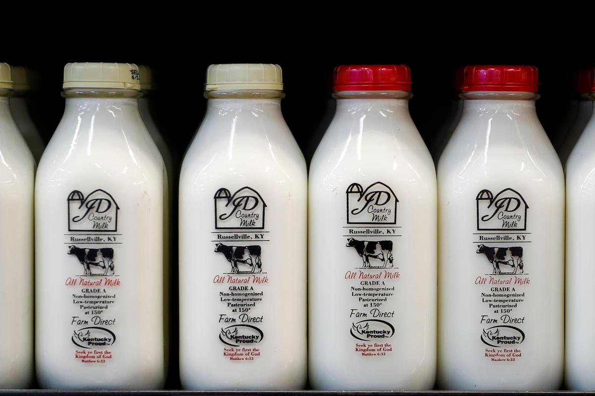 Bottles of milk from JD Country Milk located in Russellville, Ky., sit for sale at Good Foods Co-op in Lexington, Ky., Wednesday, March 25, 2020. 