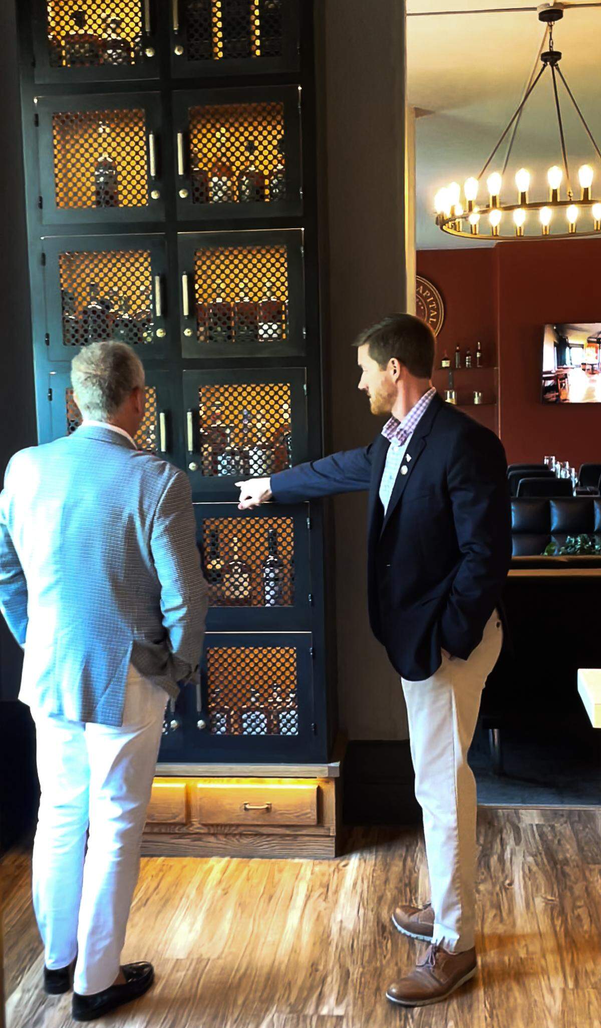 Jeff Hopmayer, left, and Sam Lacy, right, viewing 12 partner lockers in the Brindiamo Penthouse