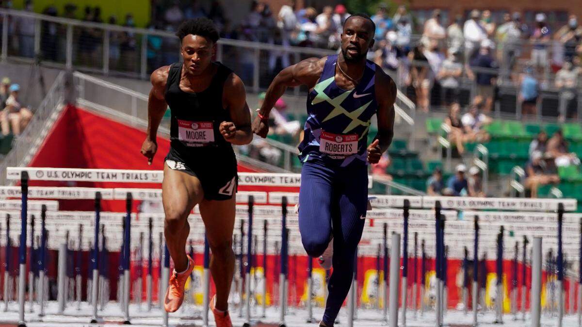 Former University of Kentucky standout Daniel Roberts, right, won his heat in the 110-meter hurdles on Friday, then finished third in Saturday’s finals to qualify for the U.S. Olympic Team.