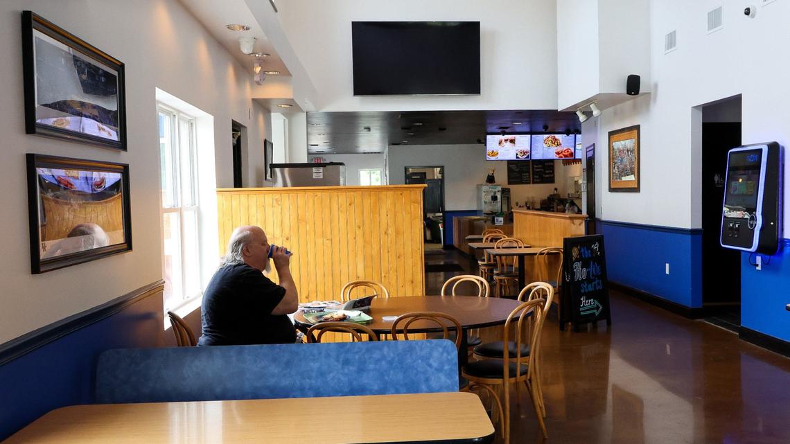 Bill Widener takes a drink while eating at the new Tolly-Ho location Sept. 3, 2024. at 350 Foreman Ave. in Lexington, Ky.The restaurant is located in the former Bad Wolf Burgers spot next to the Newtown Crossing apartment complex.