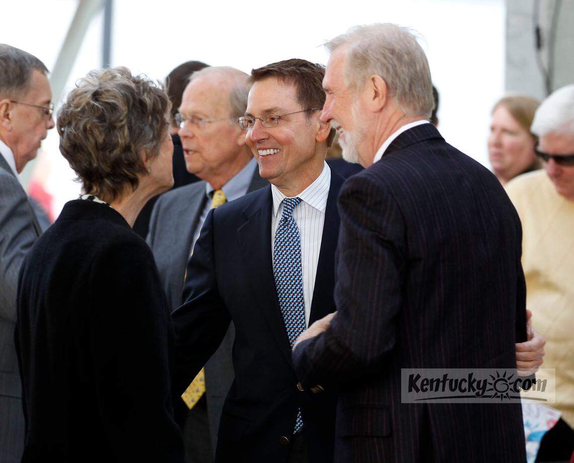 Mayor Jim Gray talked to Laura Lee Brown, left, and her husband Steve Wilson, right, after a morning news conference held in the Fifth Third Pavilion in Cheapside Park  in Lexington, Ky., Tuesday, April 10, 2012.  Lexington Mayor Jim Gray officially announced that the former First National Building, at West Main and North Upper Sts., will be converted into a 21c Museum Hotel by Steve Wilson and Laura Lee Brown. Charles Bertram | Staff