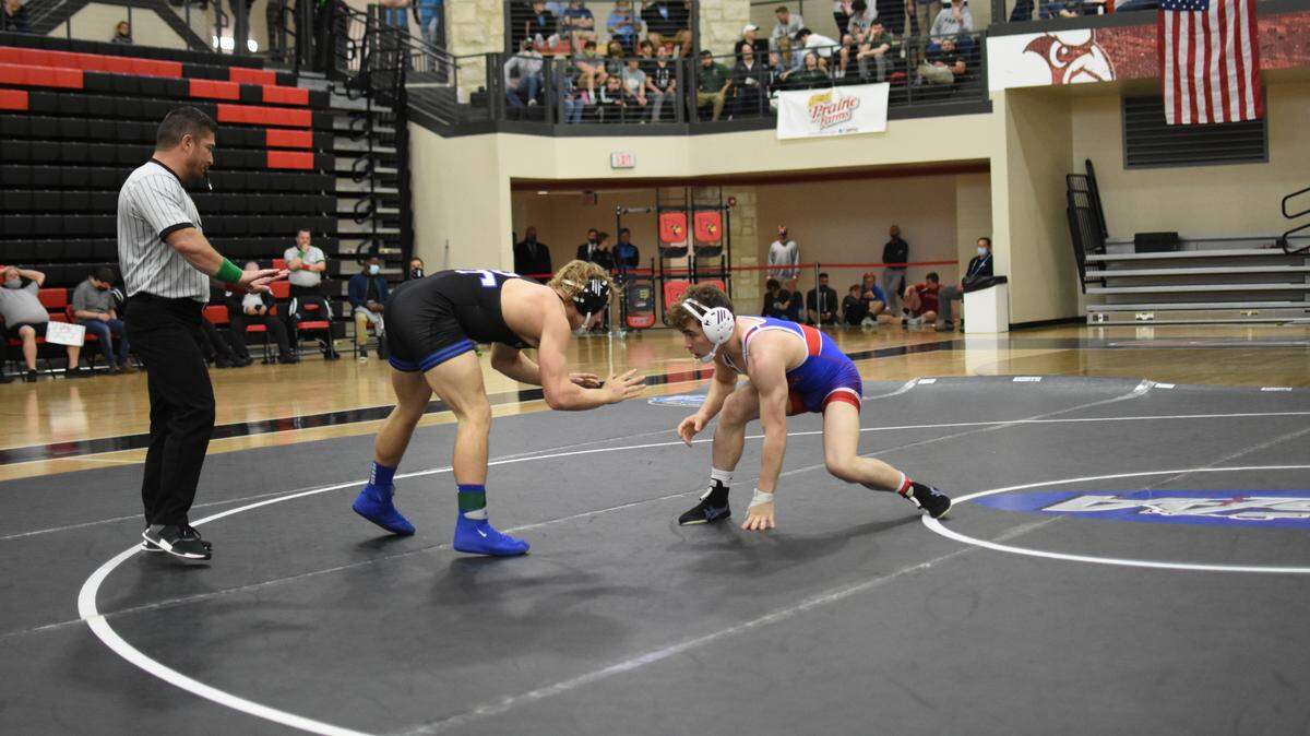 Madison Central’s Zac Cowan wrestled Paducah Tilghman’s Malachi Rider in the first-place match of the 145-pound class at the KHSAA State Wrestling Championships on March 27 at George Rogers Clark High School in Winchester. Cowan won 3-1 in overtime.