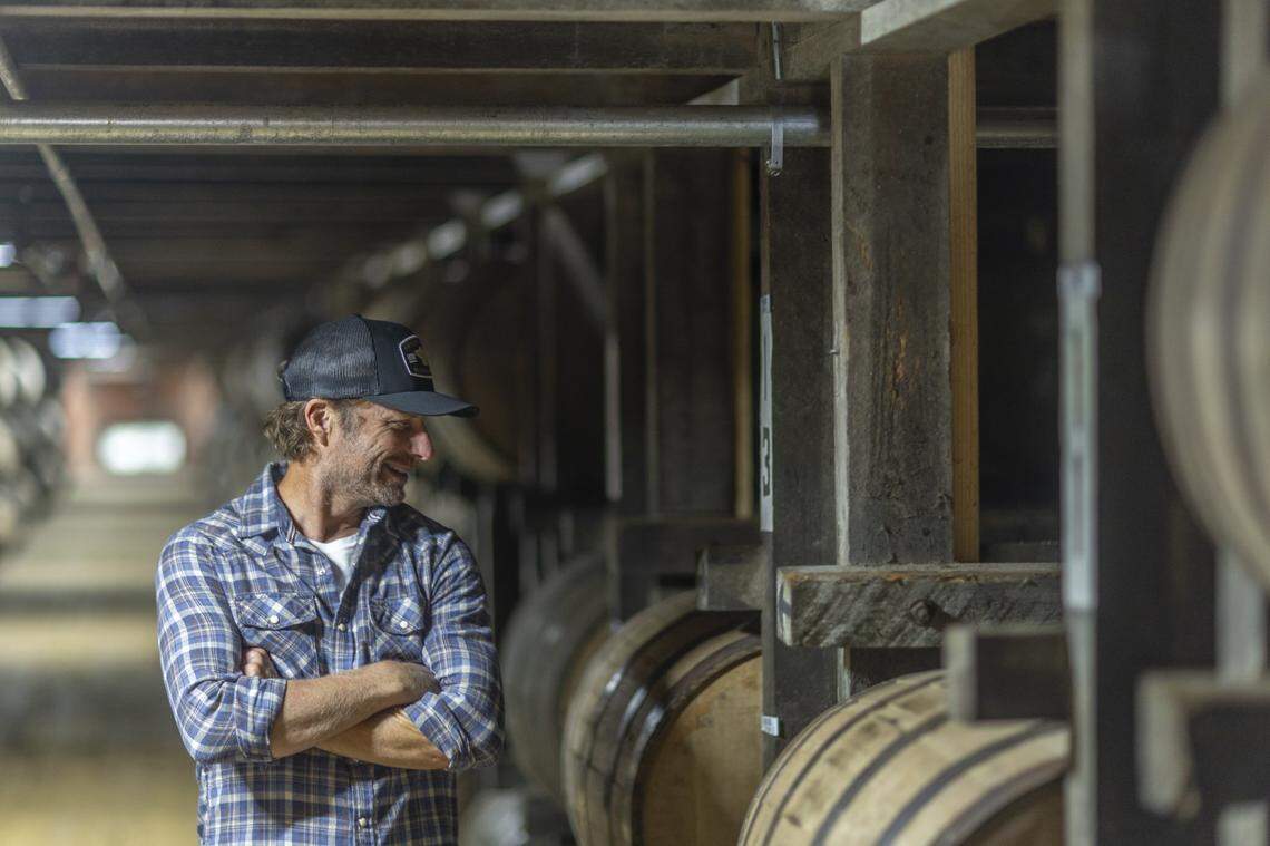 Country musician Dierks Bentley looks at barrels of whiskey aging in a warehouse at Green River Distillery in Owensboro, Ky., on Wednesday, Sept. 24, 2025. Bentley released his Row 94 Full Proof bourbon during an event at the distillery.