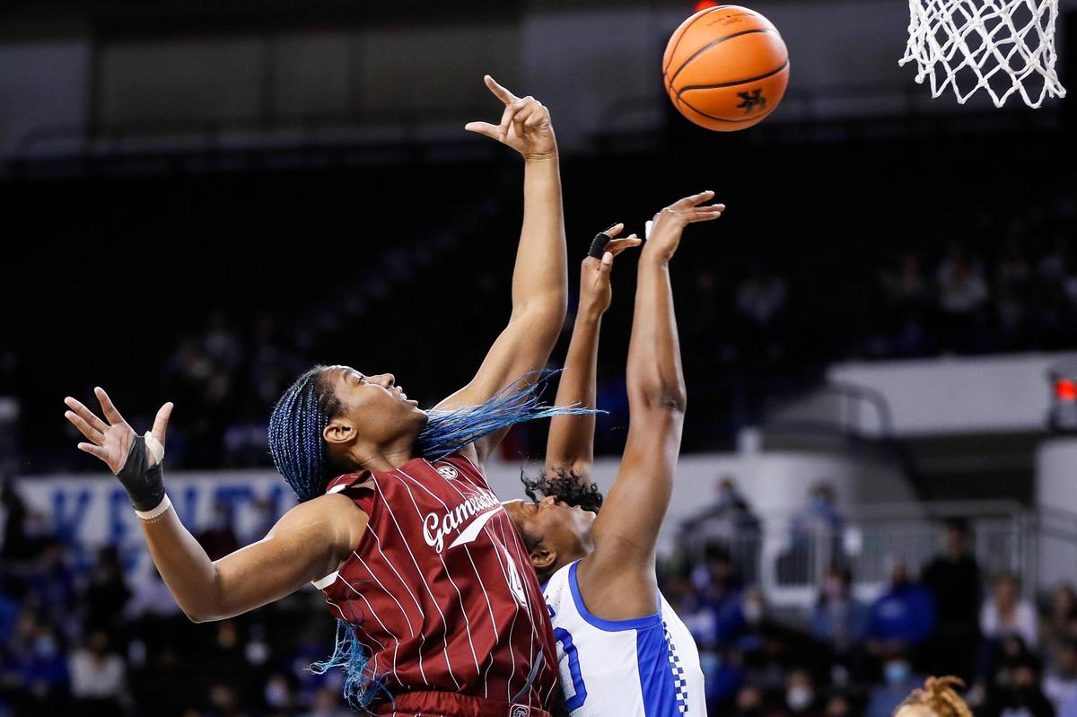 Kentucky’s Olivia Owens (00) tries to grab a rebound from South Carolina’s Aliyah Boston (4) in Memorial Coliseum on Thursday night.