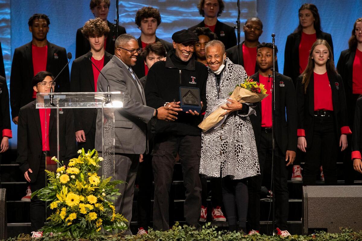 Councilman James Brown gives an honor to Chester Grundy and his wife during the city’s 50th anniversary of Martin Luther King Jr. celebrations at Central Bank Center in Lexington, Ky., Monday, January 16, 2023.