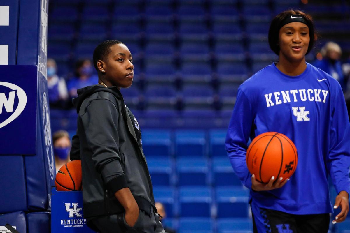 Kentucky forward Dre’una Edwards, left, watches her teammates warm up before facing the DePaul Blue Demons in Rupp Arena on Thursday night. Edwards was suspended for the game.