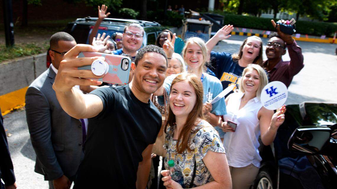 Trevor Noah, host of “The Daily Show with Trevor Noah” on Comedy Central, shot a selfie with some students Friday outside the Singletary Center for the Arts after his presentation.