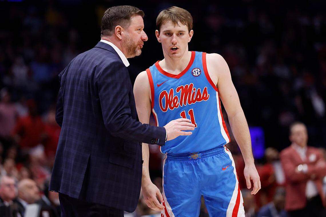 NASHVILLE, TENNESSEE - MARCH 14: Head coach Chris Beard of the Ole Miss Rebels talks with Travis Perry #11 of the Ole Miss Rebels during the second half against the Arkansas Razorbacks in the semifinal game of the 2026 SEC Men's Basketball Tournament at Bridgestone Arena on March 14, 2026 in Nashville, Tennessee. (Photo by Johnnie Izquierdo/Getty Images)