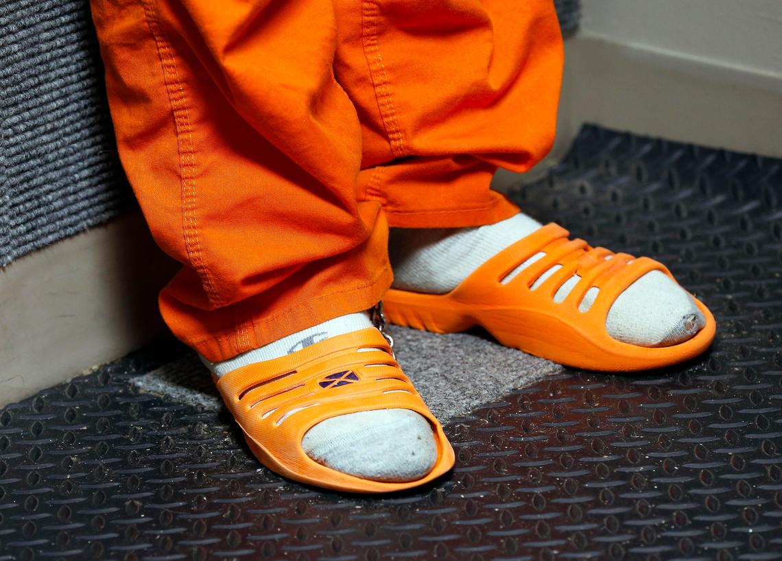 for a district court video arraignment Friday afternoon in the Fayette County Detention Center 600 Old Frankfort Pike. The inmates entered a small room where they stood against a carpeted wall and communicated with the judge via video connection.