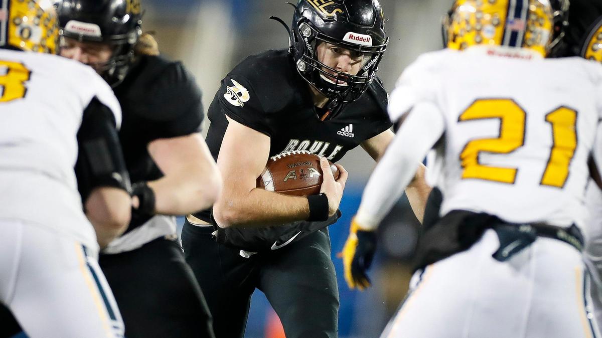 Boyle County’s Jagger Gillis (9) ran the ball between Franklin County defenders during the 2020 Class 4A state finals at Kroger Field. He accounted for three scores in the Rebels’ win over Bowling Green on Friday.