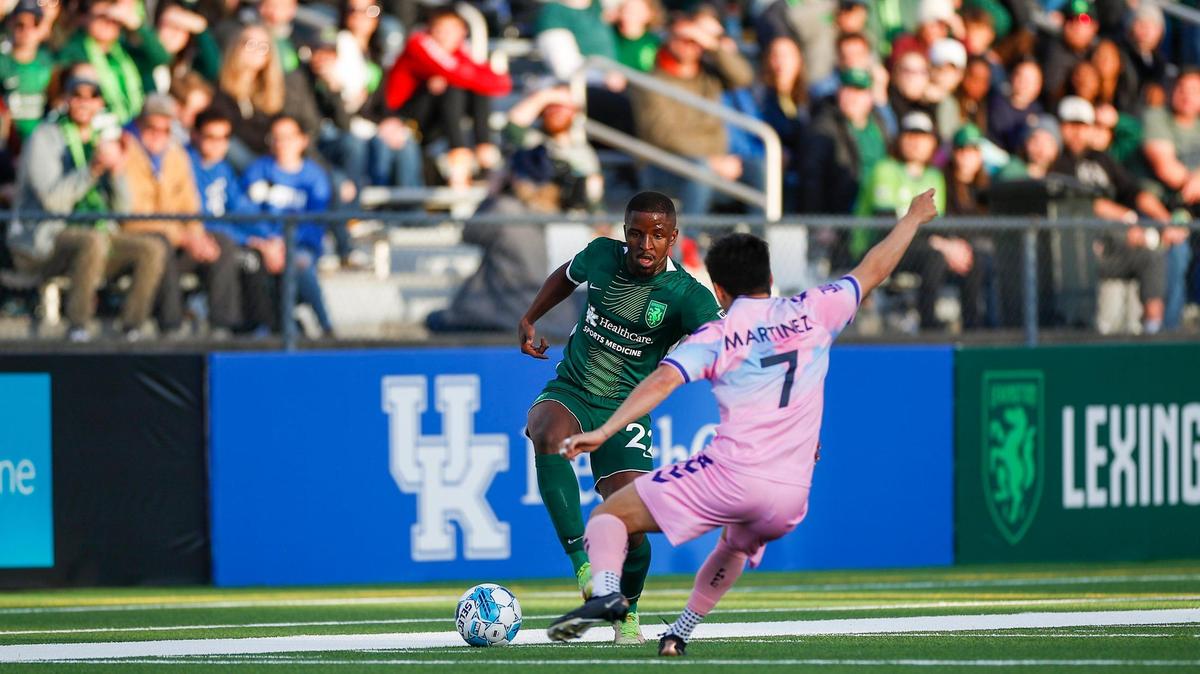Lexington Sporting Club midfielder Phila Dlamini (22) dribbles the ball around a Forward Madison FC player during his team’s first home match at Toyota Stadium in Georgetown. LSC and Forward Madison played to a scoreless draw.