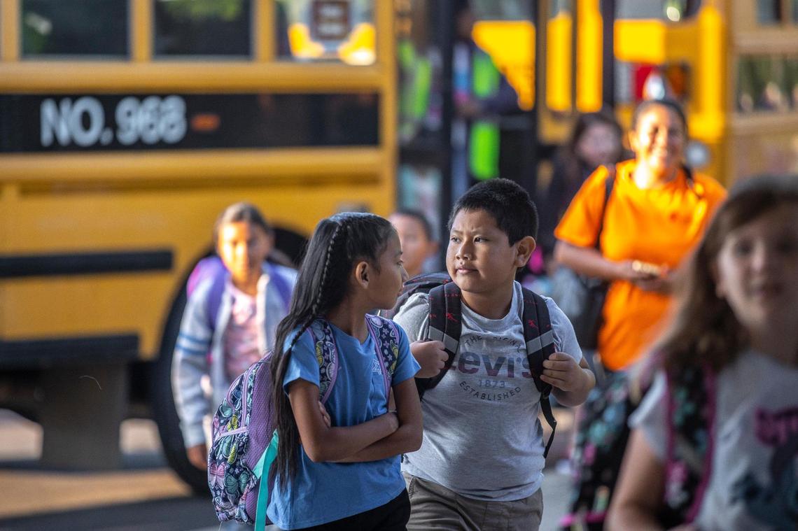 Students arrive for the first day of school at Northern Elementary School in Lexington, Ky., on Wednesday, Aug. 16, 2023.