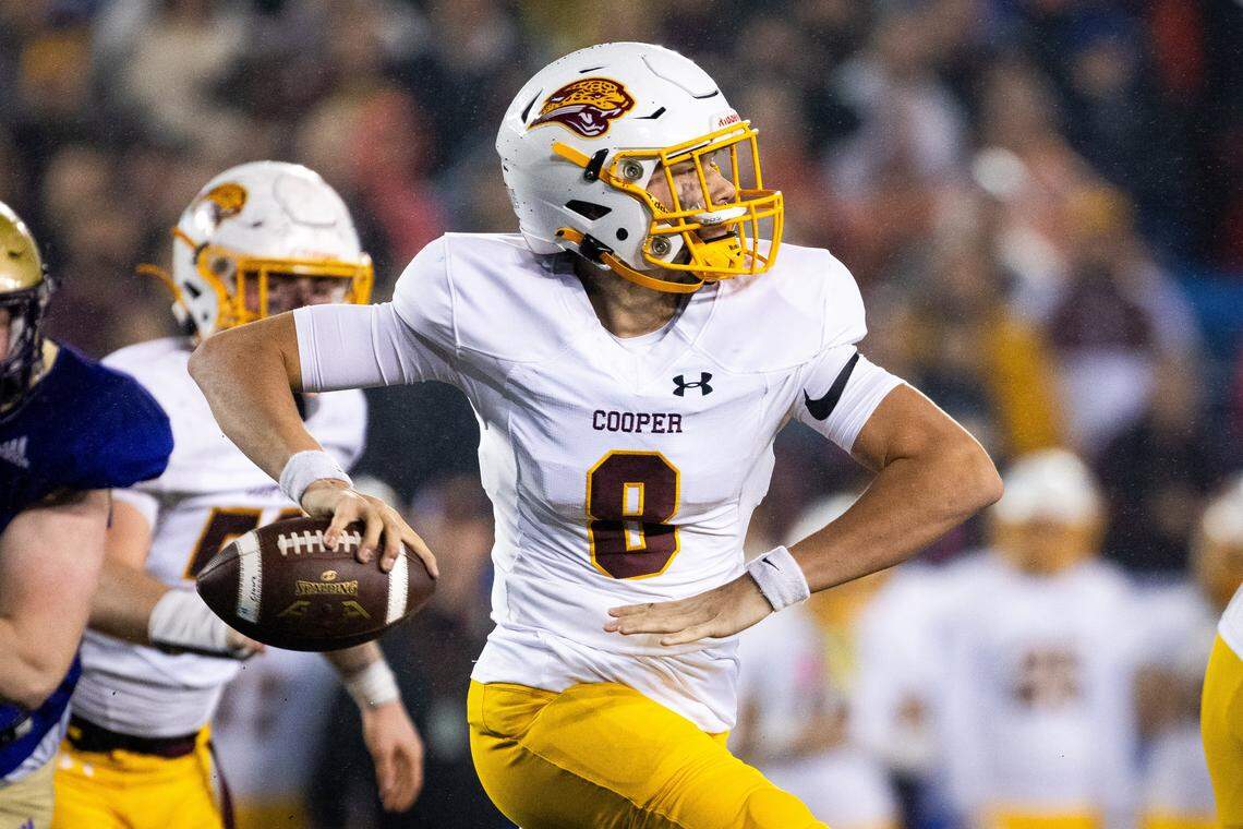 Cooper quarterback Cam O’Hara (8) throws a pass during the Class 5A State Championship at Kroger Field on Dec. 2, 2023.