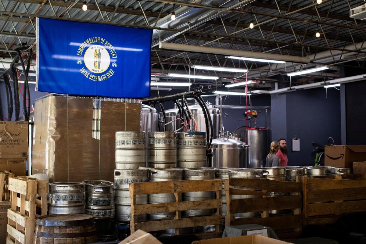 Head brewer, Patrick Fannin, and assistant brewer Maggie Wilder work on kegging some of their brews Nov. 16 at the Dreaming Creek Brewery. Fannin started as a home brewer and was waiting to see when a brewery would open in Richmond when Dreaming Creek opened in 2018.