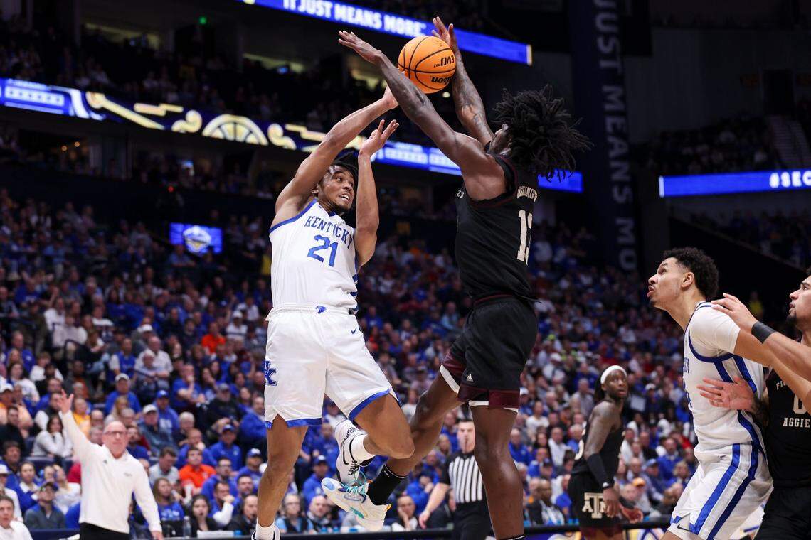 Kentucky’s D.J. Wagner is met at the rim by a Texas A&M player during the SEC Tournament quarterfinals in Nashville on Friday.