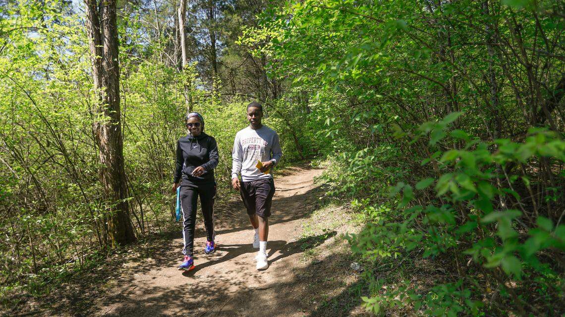 Two hikers explore a trail at Raven Run, a vast nature sanctuary in Lexington, Ky. 