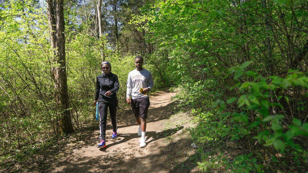 Two hikers explore a trail at Raven Run, a vast nature sanctuary in Lexington, Ky. 
