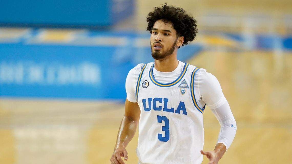 UCLA guard Johnny Juzang enters the court during the first half of an NCAA college basketball game Wednesday, Dec. 9, 2020, in Los Angeles. (AP Photo/Ashley Landis)