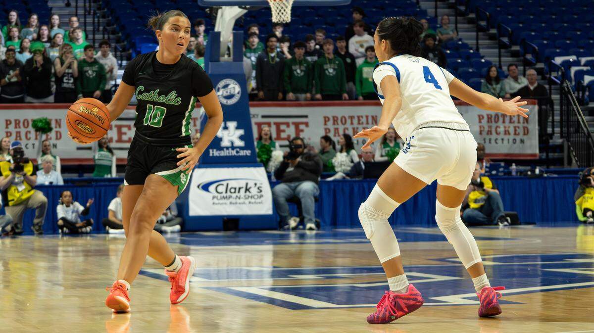 Owensboro Catholic's Claudia Munsey looks for an open pass during the 2026 Clark's Pump-N-Shop Girls' Basketball Sweet 16 state tournament first round game between Owensboro Catholic and Letcher Central on March 12, 2026, at Rupp Arena in Lexington, Ky.